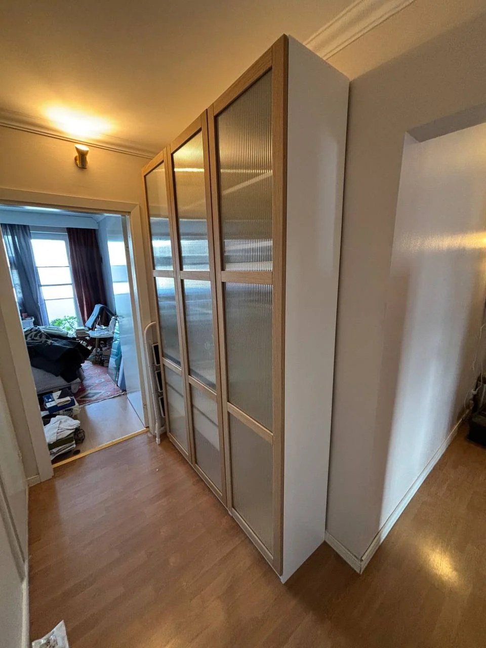 Assembled three-section IKEA wardrobe