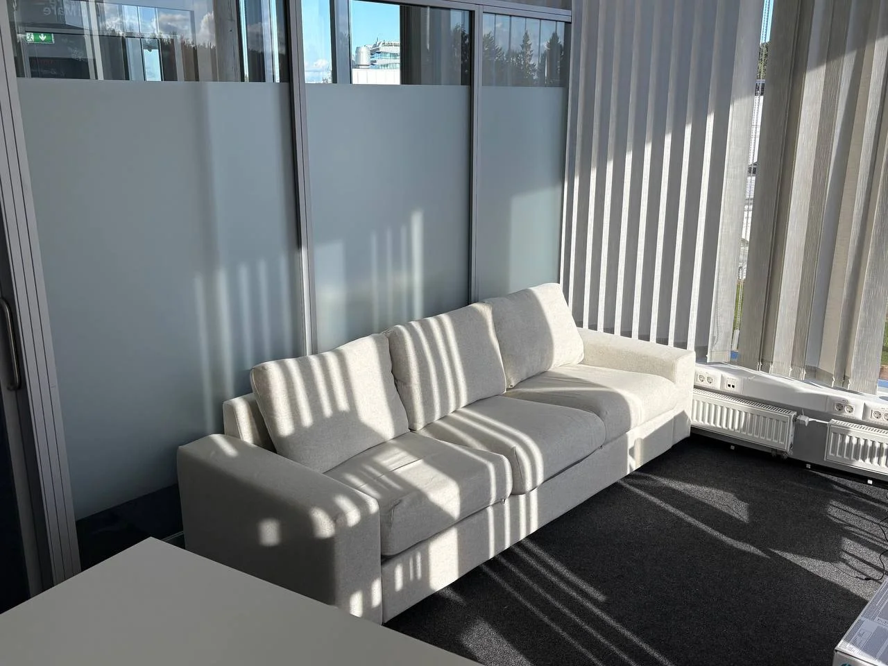 Light-coloured sofa in an office lounge